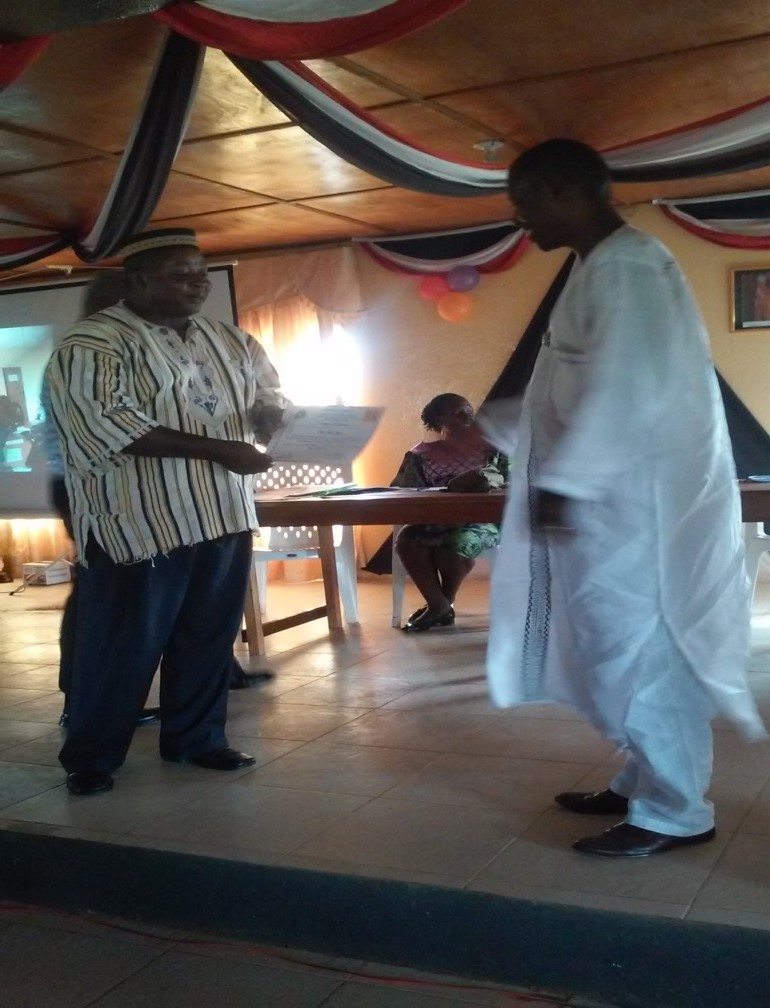 Former Superintendent Gbowee recieves honor from Superintendent Sarnor of Gbarpolu County